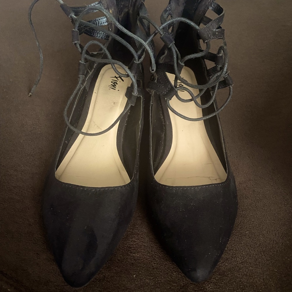 Like-new Fioni size 10 black ankle strapped flats.